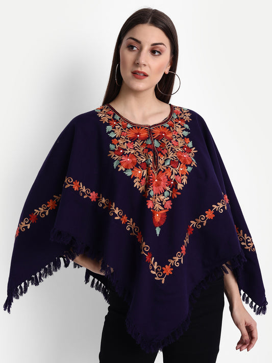 https://cdn.shopify.com/s/files/1/0629/9847/9063/products/WoolenPonchowithKashmiriEmbroideryandSilkLiningforWomenBlue2.jpg?v=1743766686